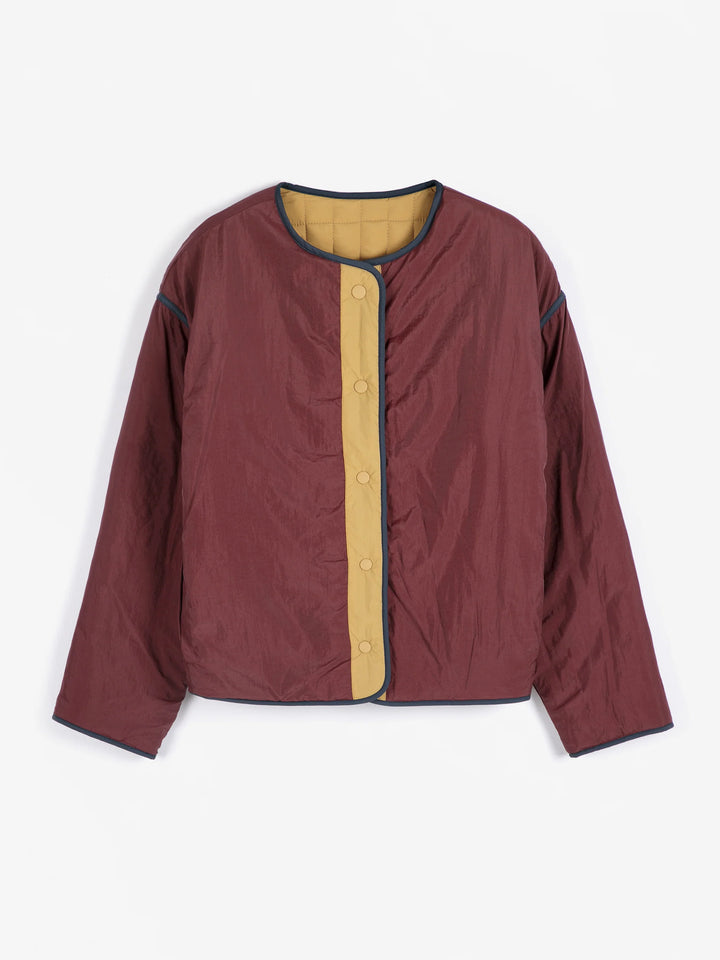 Maroon jacket with a yellow inner lining on a white background