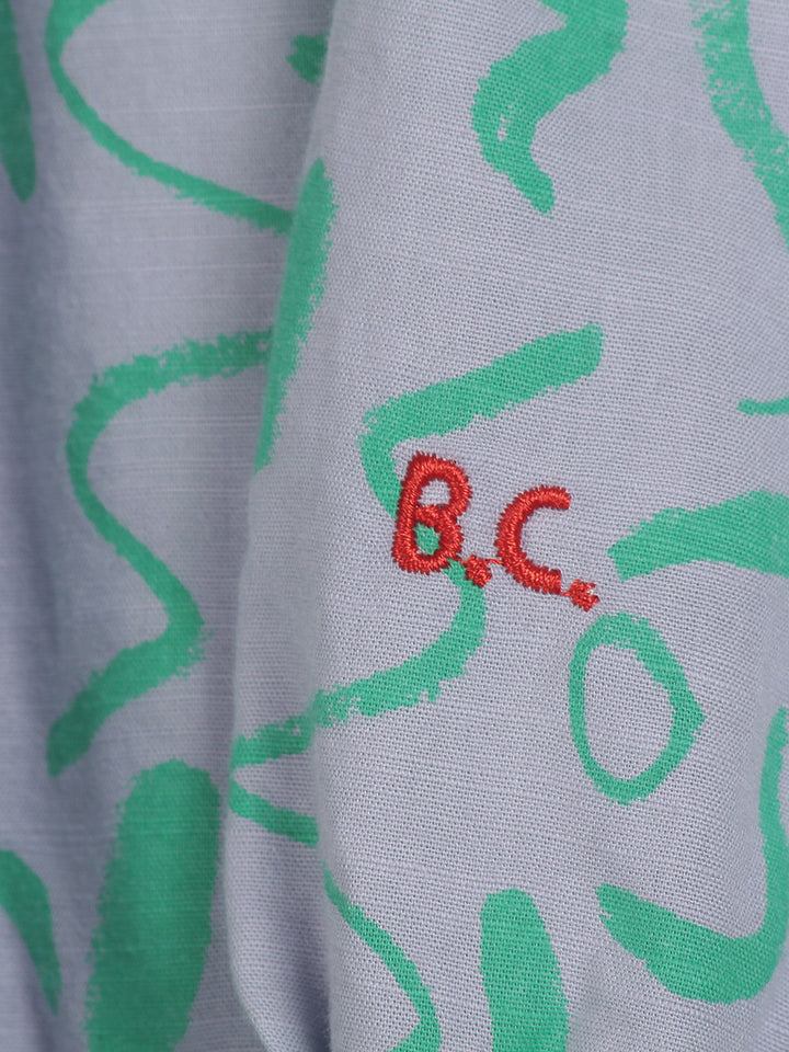 Vestit llarg amb coll en punta serpentines