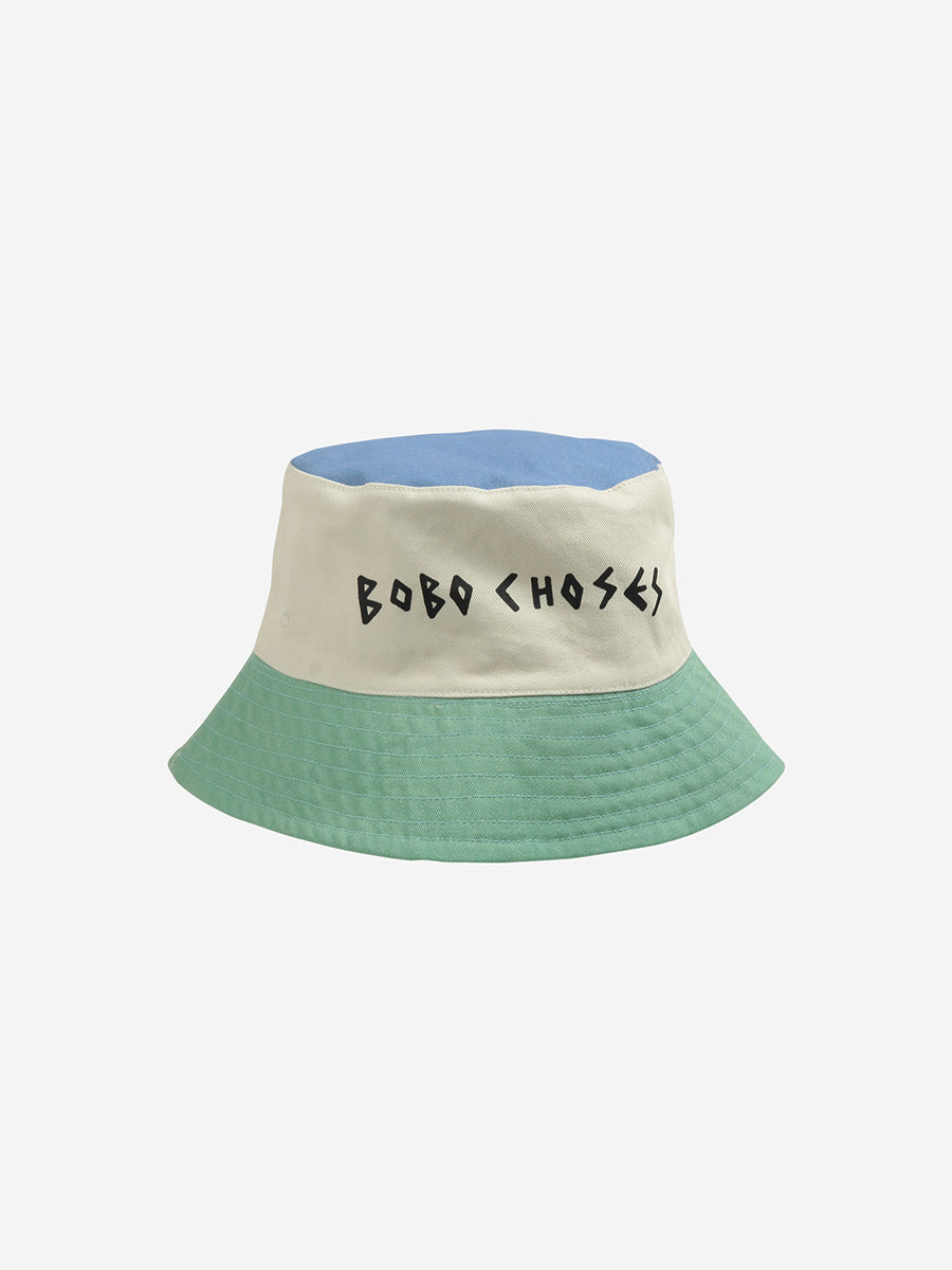 Striped reversible fisherman cap