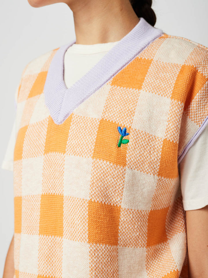 Armilla de punt de quadres amb coll en punta