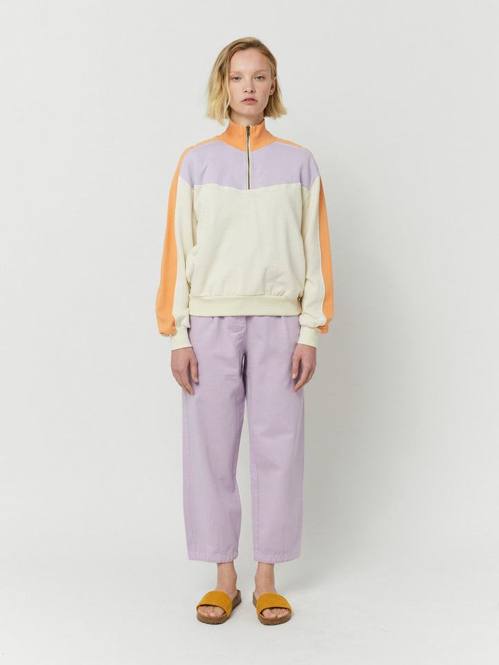 Dessuadora amb cremallera i blocs de color