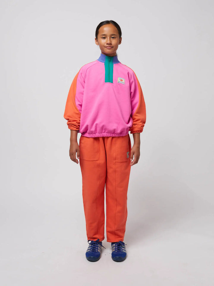 Smiling red jogging pants