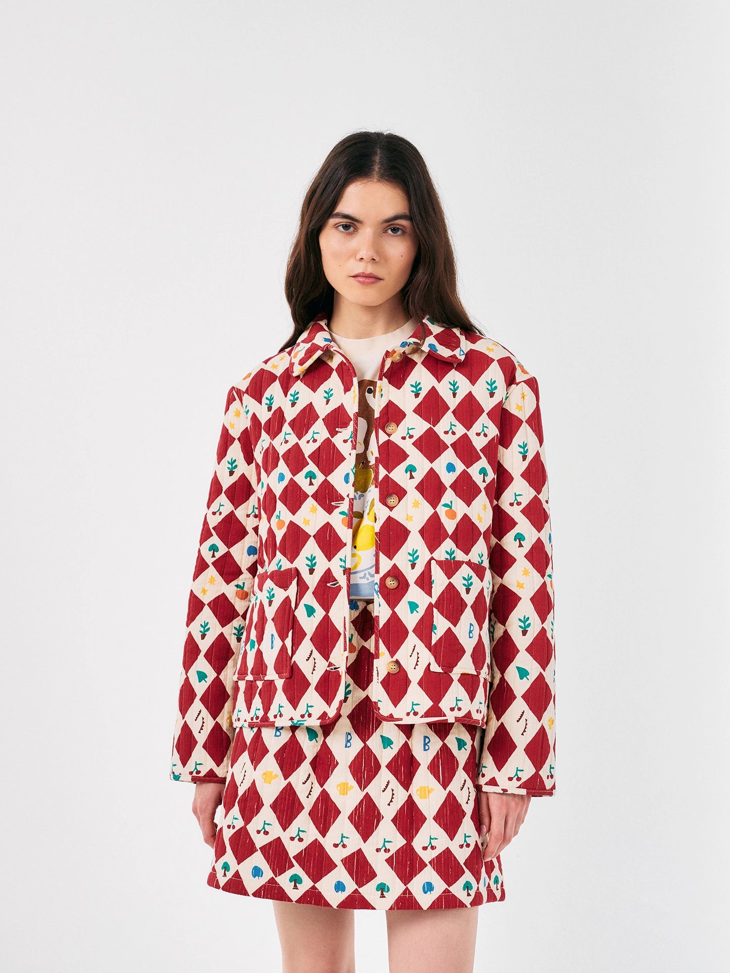 Harlequin printed quilted cropped jacket