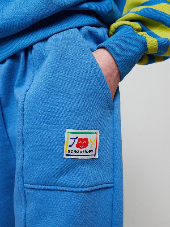 Smiling blue jogging pants