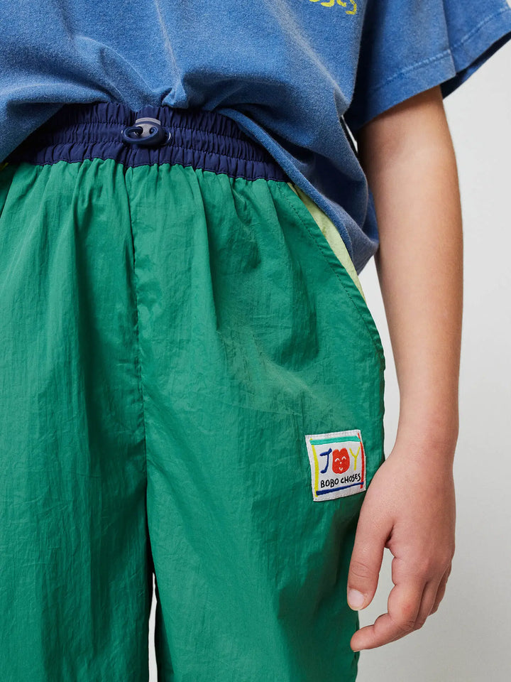 Smiling color block tracksuit pants