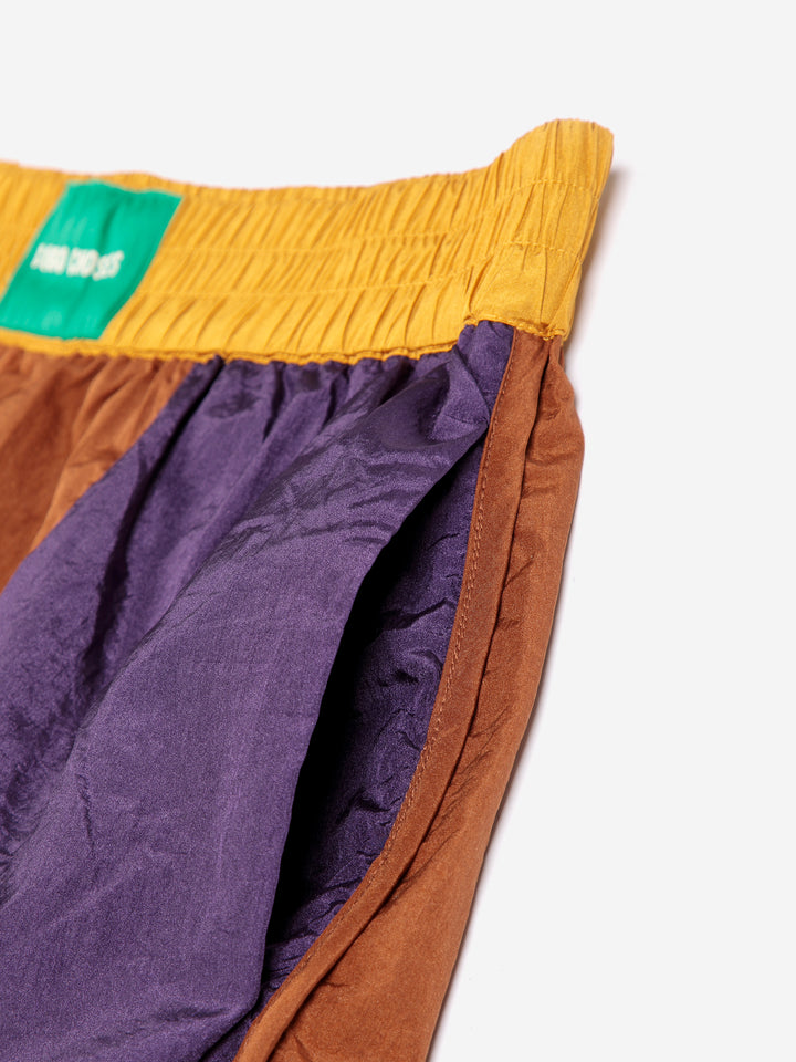 Shiny color block nylon shorts