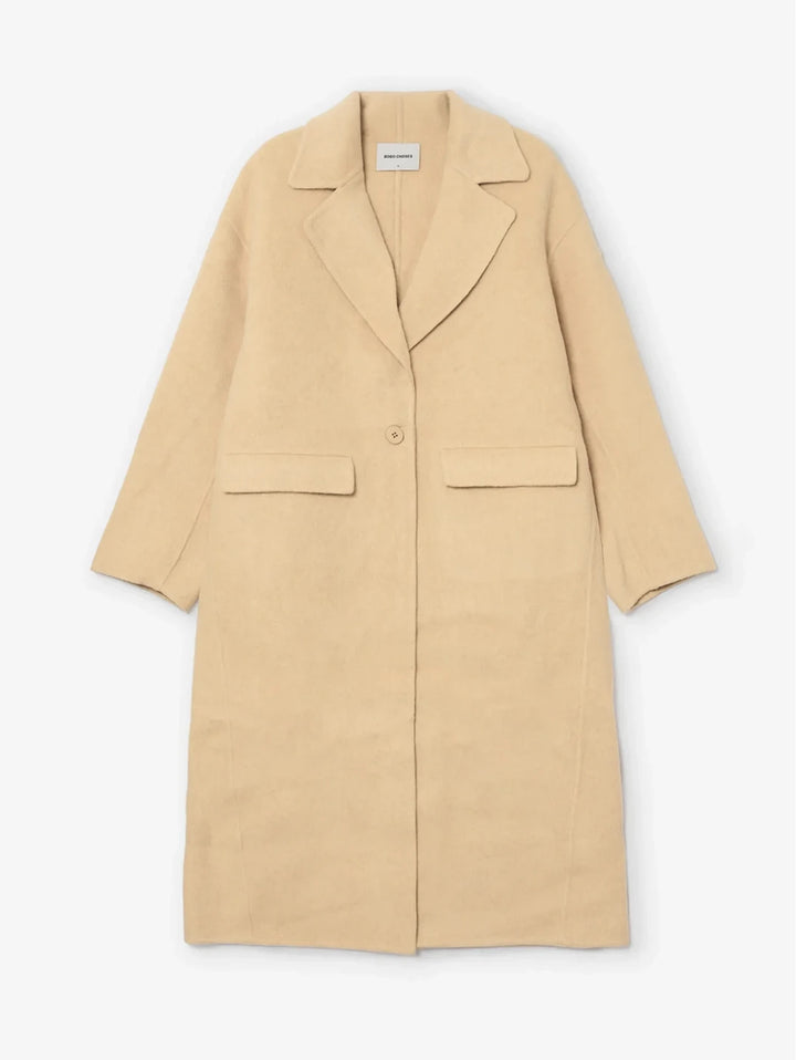 A light beige wool-blend coat with a single button closure, notched lapels, and two front flap pockets, shown flat against a light gray background.