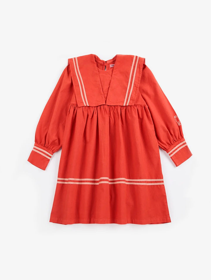 A red long-sleeve dress with white stripe accents on the collar, cuffs, and hem, displayed flat against a light gray background.