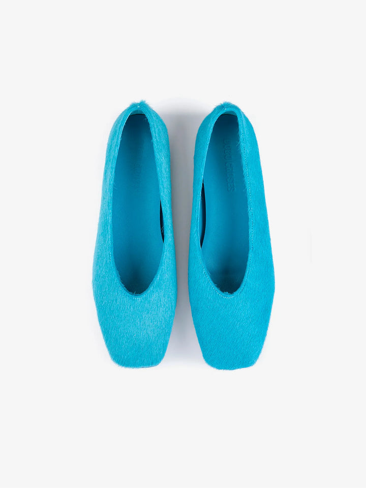 Turquoise pony hair ballet flats, top view