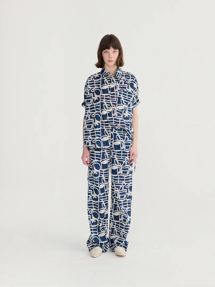 Cookery festival pattern wide-leg trousers