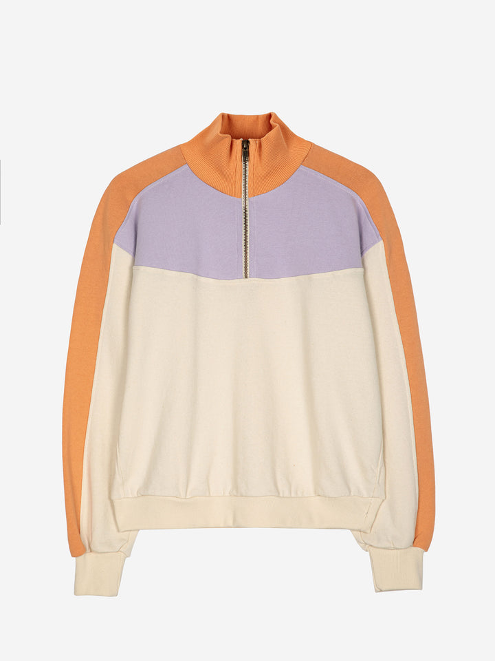 Dessuadora amb cremallera i blocs de color