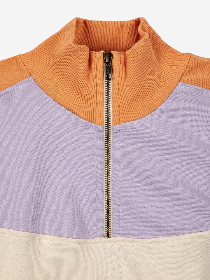 Dessuadora amb cremallera i blocs de color