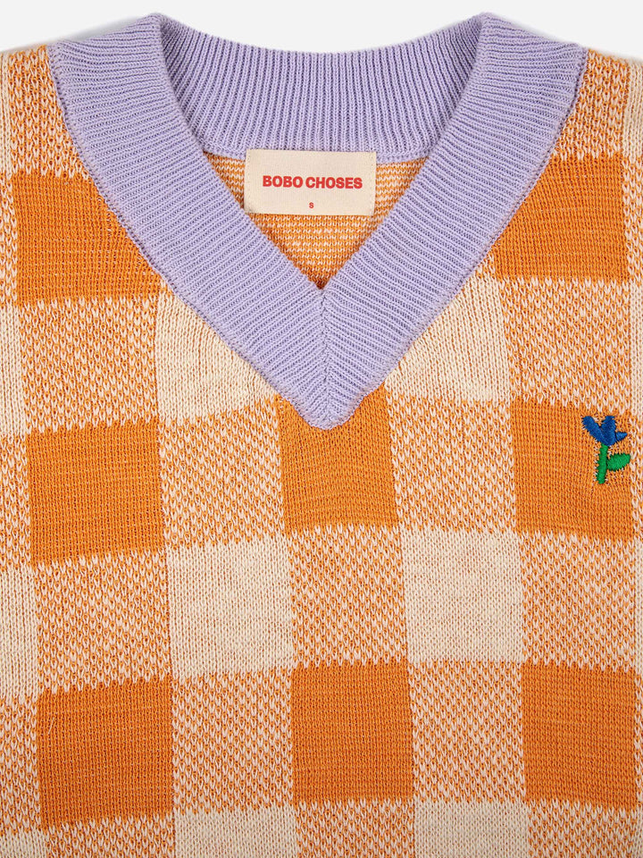 Armilla de punt de quadres amb coll en punta